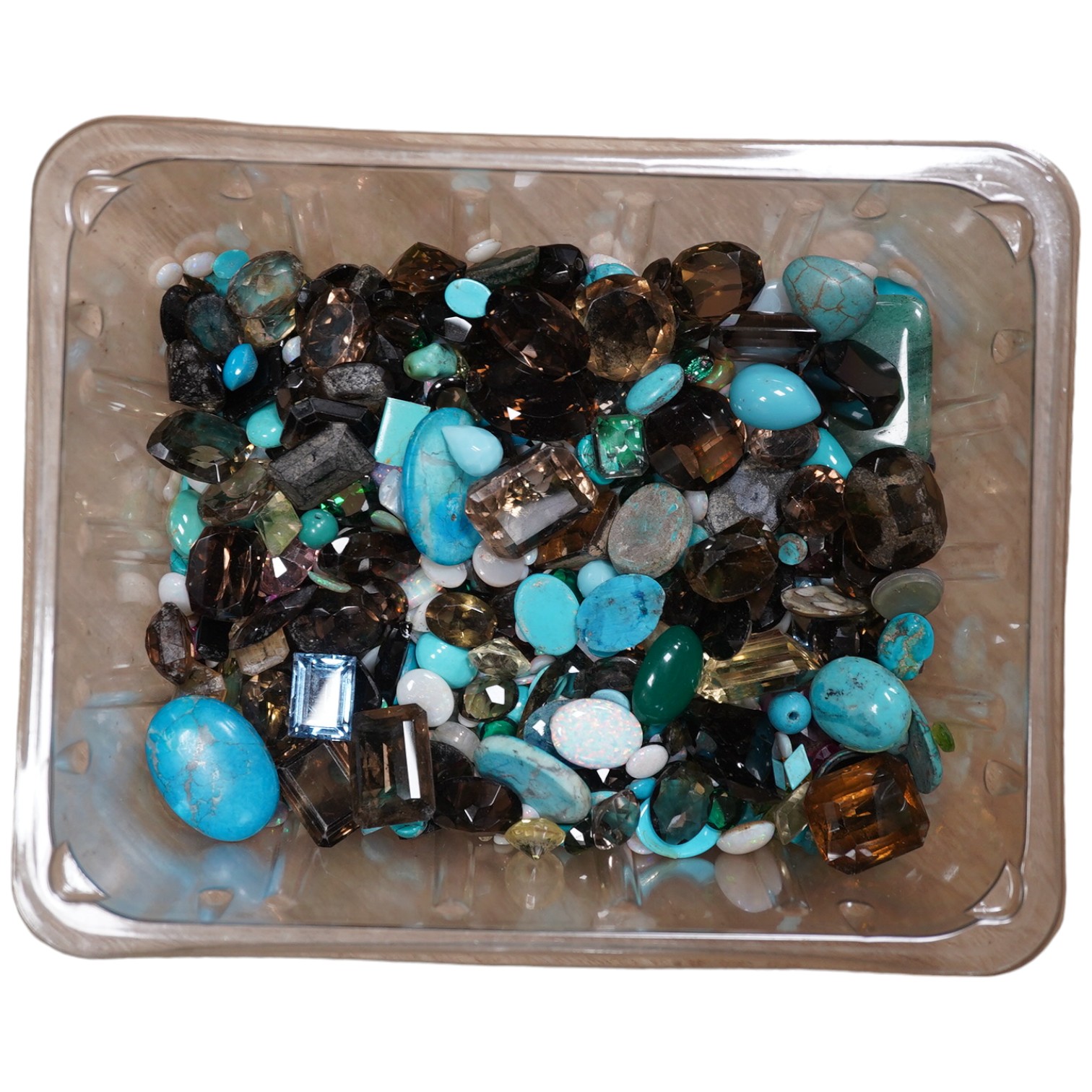 A large quantity of assorted unmounted cut and cabochon gemstones etc, including opal, quartz and turquoise. Condition - poor to fair to good